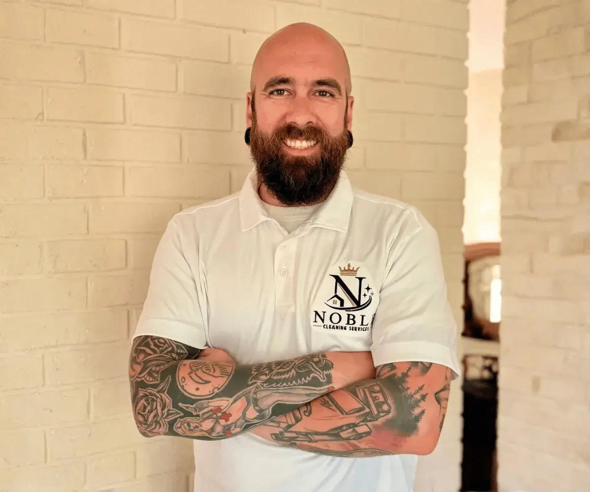 Noble House Cleaning owner in a branded company polo, serving Bergen County, NJ
